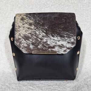 Artisanal Black Leather Handbag with Cowhide Flap & Gold-Tone Hardware